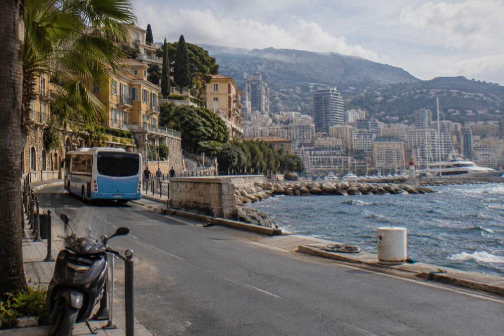 A coastal bus travelling the corniche road between Nice and Monaco with sea views