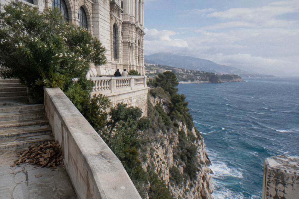 Grand stone facade of the Oceanographic Museum on the cliffside above the sea